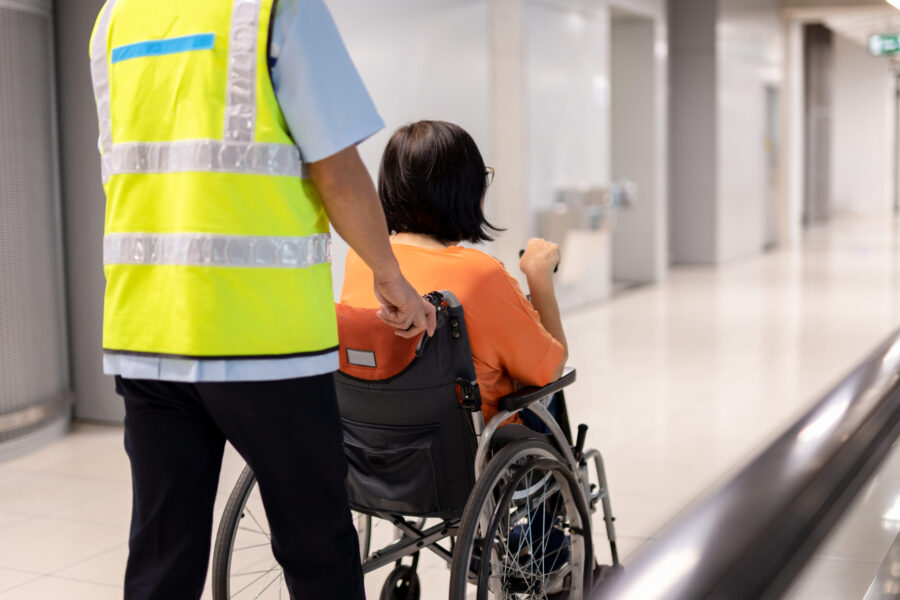 pushing-person-in-wheelchair