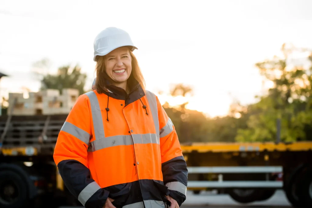 stock image of female in high vis jacket and helmet
