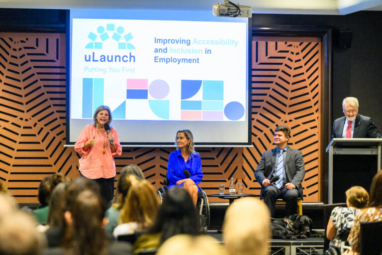 An image of Aunty Thelma, Karni Liddell, Paul Harpur and Peter Shergold on stage conducting the panel.