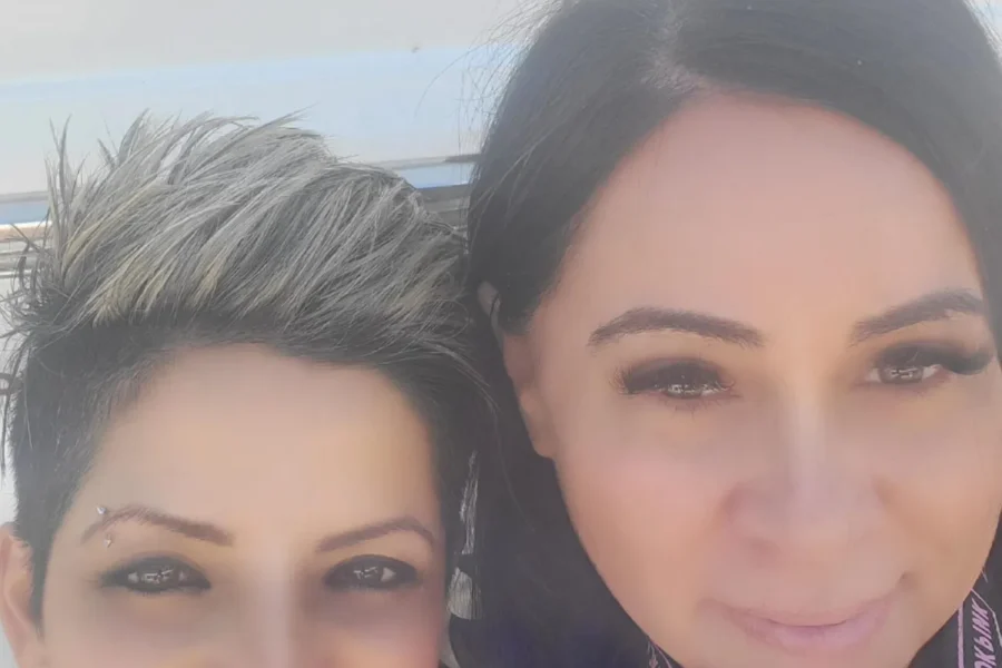 AM Sandy and Stylist smiling at the camera