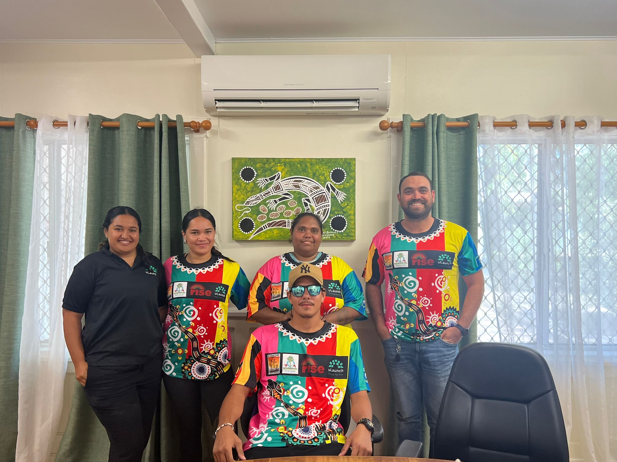 Image of uLaunch staff wearing the new NAIDOC t-shirt.