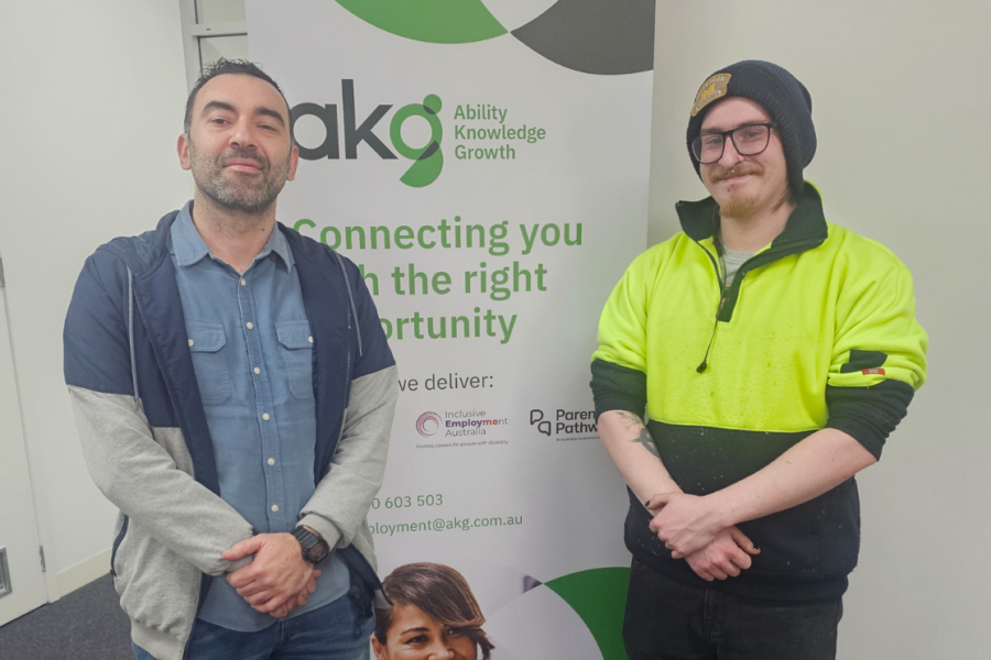 Hayden and AKG Job Coach Metehan celebrating career growth through Workforce Australia