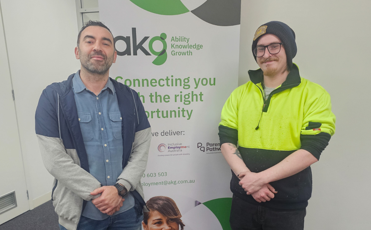 Hayden and AKG Job Coach Metehan celebrating career growth through Workforce Australia